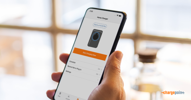 Person holding mobile phone with ChargePoint app on it