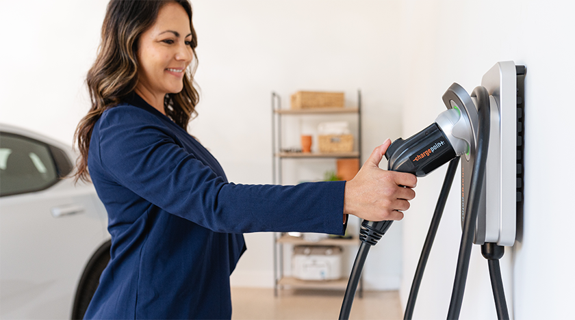 Woman using ChargePoint Home Flex
